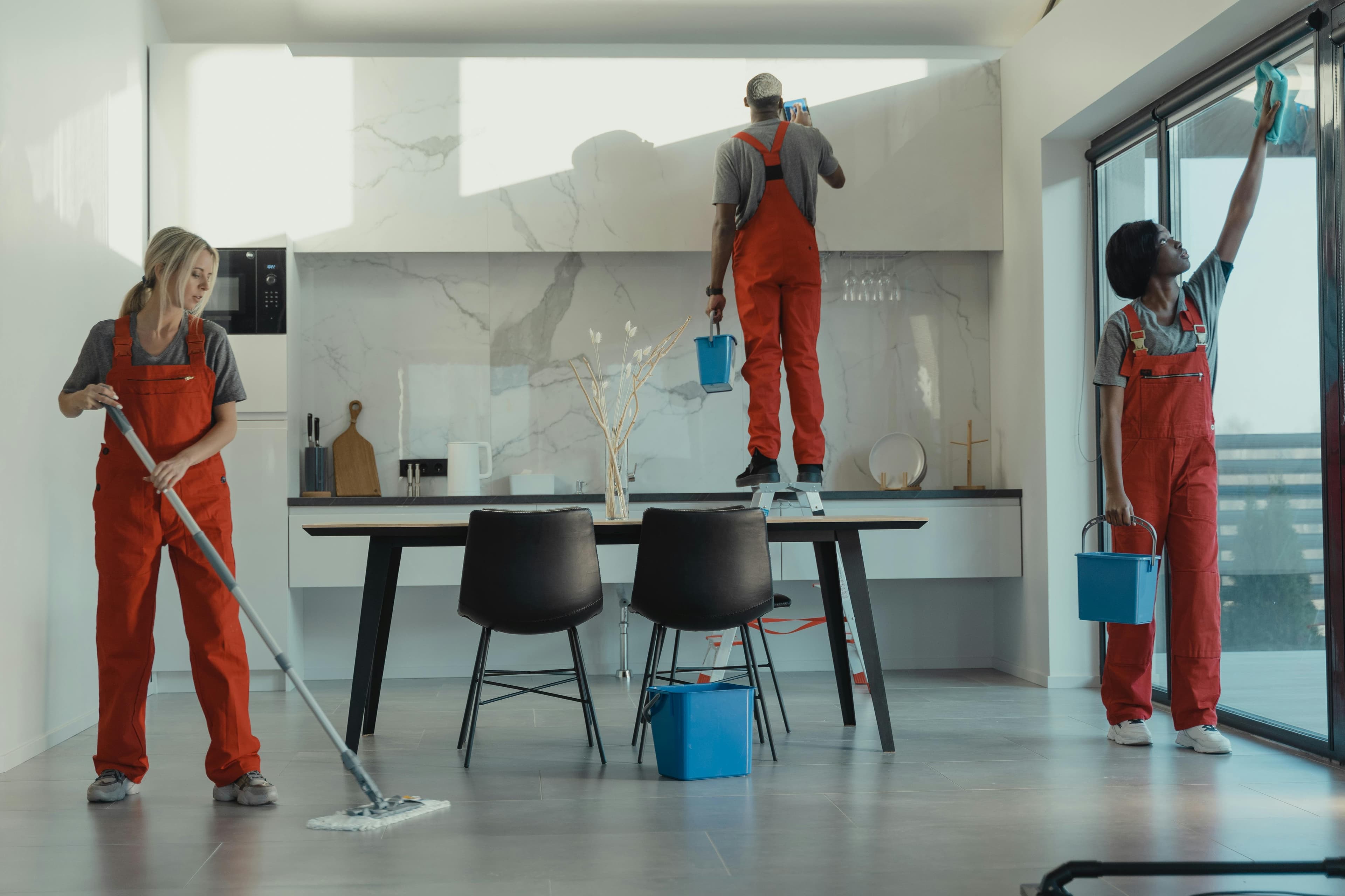 OCS team cleaning a modern residential kitchen
