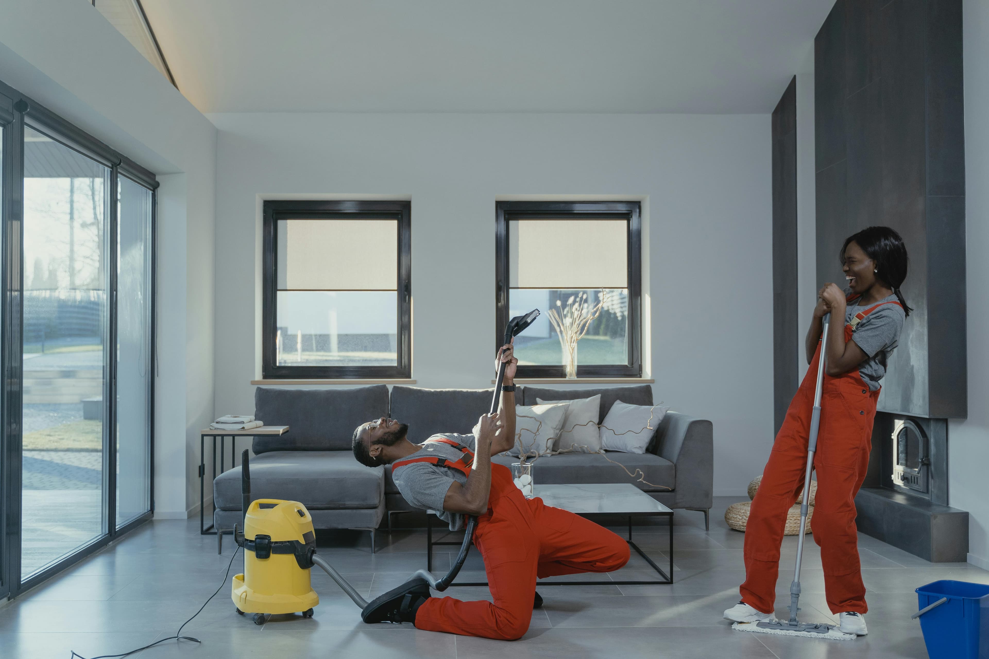 OCS crew vacuuming and mopping a living room